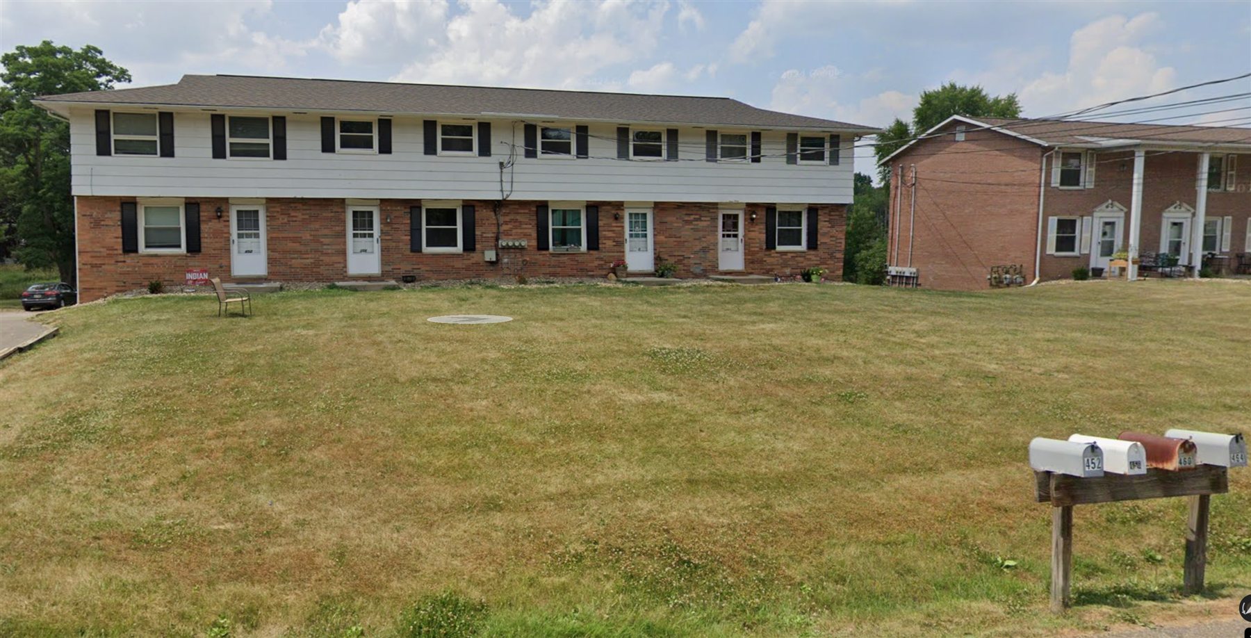 Two-story apartment building with mailboxes