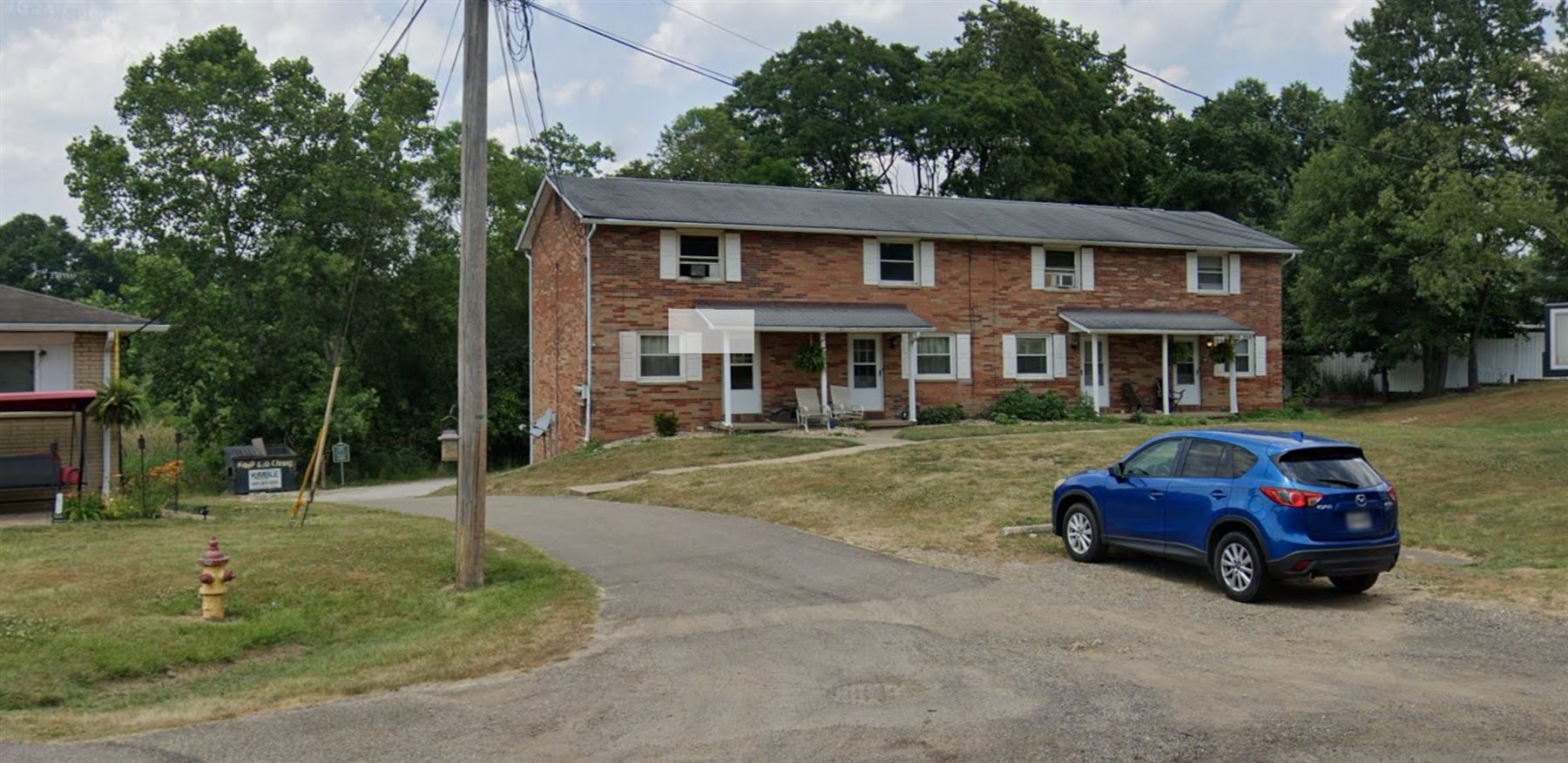 Brick apartment building near driveway